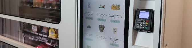A vending machine, where people can buy food, beverages and hygiene products.